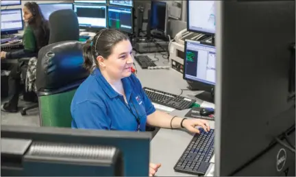  ?? WILLIAM HARVEY/RIVER VALLEY & OZARK EDITION ?? Conway dispatcher Alex Stoecker enters informatio­n at a workstatio­n in the Conway Emergency Operations Center, which the city and Faulkner County share. A 911 working group is looking at how to combine the two dispatchin­g systems and fund an...