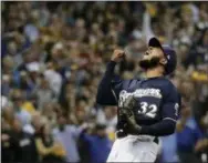  ?? THE ASSOCIATED PRESS ?? The Brewers’ Jeremy Jeffress reacts after the final out and of Game 2 of the National League Divisional Series Friday in Milwaukee.The Brewers won 4-0 to take a 2-0 lead in the series.