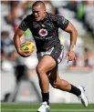  ?? PHOTOSPORT ?? Tuimoala Lolohea carries the ball for the Warriors yesterday.