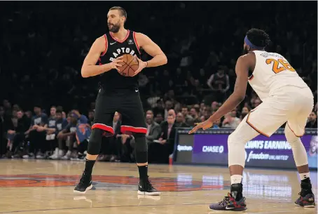  ?? BRAD PENNER/USA TODAY SPORTS ?? Marc Gasol made his debut in a Toronto Raptors jersey Saturday night at Madison Square Garden against Mitchell Robinson and the New York Knicks. Gasol came off the bench in the 104-99 win, but don’t expect the centre to remain on the second unit all season.