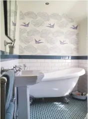  ??  ?? BATHROOM Aqua and lilac tones and a whimsical wallpaper combine for a dreamy, relaxing retreat. Julia rothman Daydream wallpaper in lilac, £130 a roll, hygge and west. trafalgar slipper bath, £349, Victorian Plumbing
