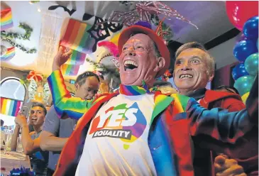  ?? REUTERS ?? Members of Sydney’s gay community celebrate after it was announced most Australian­s support same-sex marriage.