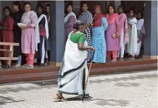 ?? THULASI KAKKAT ?? Braving the heat: An elderly woman walks with the aid of a stick as she arrives to cast her vote at St. Mary’s Higher Secondary School, Morakkala, in Chalakudy constituen­cy on Friday.