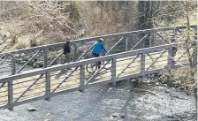  ??  ?? A cyclist crosses a bridge on the Rio Grande Trail in 2019 in Aspen.