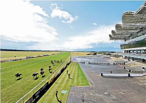  ??  ?? Behind closed doors: Kameko, ridden by Oisin Murphy (left), wins the Qipco 2,000 Guineas ahead of Wichita and Pinatubo in front of the empty main stand at Newmarket