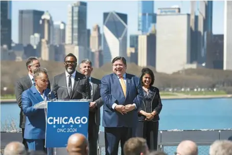  ?? CHRIS SWEDA/CHICAGO TRIBUNE ?? Chicago Mayor-elect Brandon Johnson, third from left, and Illinois Gov. J.B. Pritzker, second from right, have a laugh as Mayor Lori Lightfoot speaks during a news conference Wednesday to celebrate Chicago’s selection as the host for the 2024 Democratic National Convention.