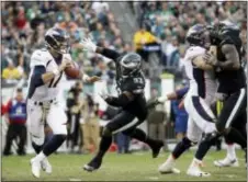  ?? MATT ROURKE — THE ASSOCIATED PRESS ?? Eagles lineman Tim Jernigan, 93, here applying pressure to Denver quarterbac­k Brock Osweiler last Sunday, signed a four-year contract to stay in Philadelph­ia Thursday.