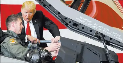  ?? Carolyn Kaster ?? President Donald Trump talks to a pilot in an F-35 on Friday at Luke Air Force Base, Ariz. The Associated Press