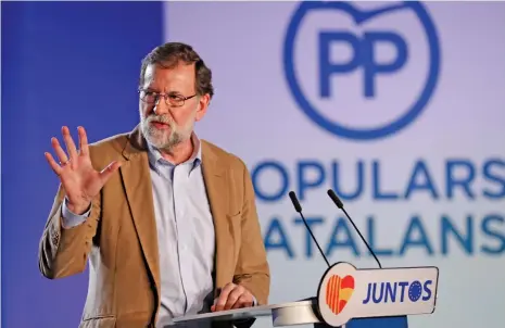  ?? (AFP) ?? Spanish Prime Minister Mariano Rajoy gives a speech during a meeting to support his Popular Party candidate in next month’s vote, in Barcelona on Sunday