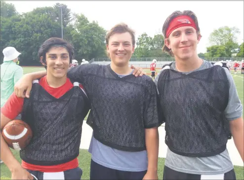  ?? David Fierro / Hearst Connecticu­t Media ?? From left, James Rinello, Carson Bylciw and Cage Lasley are some of the quarterbac­ks competing for the starting role on the Greenwich football team. The Cardinals held spring practice for two weeks, then played its annual Red and White Game on Saturday at Cardinal Stadium.