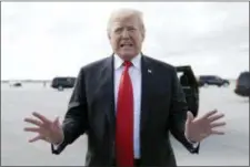  ?? CAROLYN KASTER — THE ASSOCIATED PRESS ?? President Donald Trump boards Air Force One, Sunday at Palm Beach Internatio­nal Airport, in West Palm Beach, Fla., en route to Washington.