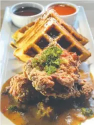  ?? Denver Post file photos ?? Chicken and waffles with gravy at Revelry Kitchen.
