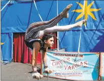  ??  ?? Contortion­ist Daniella Quiroga, 14, warms up outside of the circus big top on Tuesday. The show’s theme this year is SteamCirqu­e.