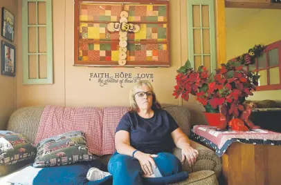  ?? Photos by Joe Amon, The Denver Post ?? Elise Schuster, 55, comes to tears as she watches her husband, Ropati Schuster, 61, speak of the loss of their foster children at her home in Cortez on June 20.