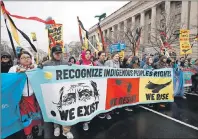  ?? AP PHOTO/MANUEL BALCE CENETA ?? Native groups and their supporters march toward the White House in Washington last Friday to rally against continued constructi­on of the disputed Dakota Access pipeline.