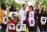  ?? Patrick Semansky / Associated Press ?? Family members of Americans held hostage or wrongfully detained stand near the White House.