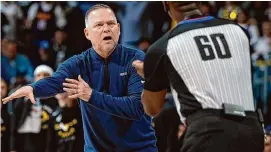  ?? David Zalubowski/Associated Press ?? Denver Nuggets coach Michael Malone argues for a call with referee James Williams in the second half of Game 5 of an NBA basketball first-round playoff series on April 29 in Denver.