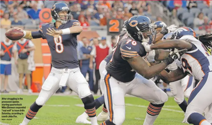  ??  ?? After struggling in the preseason opener, starting quarterbac­k Mike Glennon responded “real well” in team drills Saturday, according to coach John Fox. NAM Y. HUH/ AP