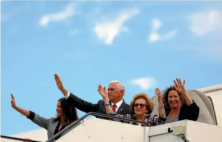  ?? AP ?? US Vice President Mike Pence and members of his family, his wife Karen Pence, left, mother Nancy Pence-Fritsch, and sister Ann Poynter, right, wave goodbye as they board Air Force Two at Dublin airport Ireland.