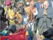  ?? PTI ?? Lieutenant Governor Anil Baijal interacts with the relatives of Bawana fire victims outside a hospital in New Delhi on Sunday.