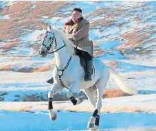  ??  ?? North Korean leader Kim Jong Un rides a white horse to climb Mount Paektu.