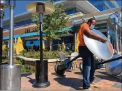  ?? COURTESY OF THE SELECT ?? OUTDOOR DINING: Patio heaters are installed at the Select in Sandy Springs. When the weather turned cold, some of us bundled up and dined near a heater, if we were lucky.