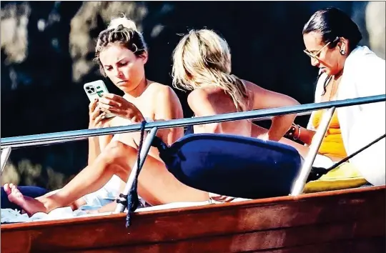  ??  ?? THREE MUSES: Jack’s cruising companions – all models or ex-models – take in the sun. From left: Erica Pelosini, Rachel Zalis and Maria Buccellati