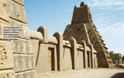  ??  ?? The Djinguereb­er Mosque, which was funded by Musa, still looms large over the Timbuktu landscape today