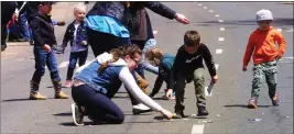  ?? ?? Children run down pieces of candy is a staple of the Gold Nugget Days parade in Paradise. The parade is set to begin at noon Saturday and conclude at about 1 p.m. The Skyway will be closed starting at 11 a.m.