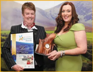  ??  ?? Helen O’Sullivan (IRD Duhallow) making a presentati­on to Sister Helen Canning (Mercy House, Kanturk), who won in the Best Community Enterprise category at last year’s Awards.