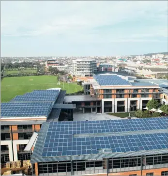  ??  ?? SUNTRAP: The biggest roof-mounted solar photovolta­ic system in southern Africa is being installed at Black River Office Park.