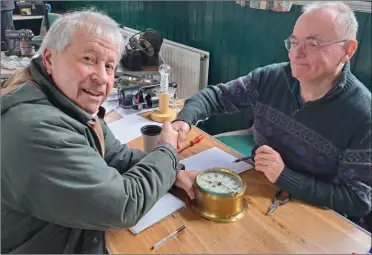  ?? ?? Reporter Alan Smith thanks volunteer Bob Watts for fixing his nautical-themed clock at Bearsted Repair Cafe