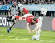  ?? AP ?? Wales’ Hallam Amos drops the ball as he attempts to score a try during the Pool D match against Uruguay.