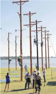  ?? [PHOTOS BY JIM BECKEL, THE OKLAHOMAN] ?? An obstacle course event takes place at the 2016 Municipal Electric Systems of Oklahoma Lineworker­s Rodeo and Safety Training.