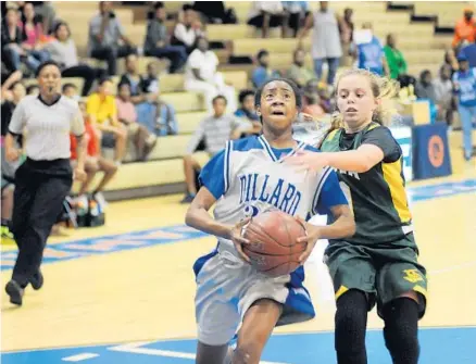  ?? PHOTOS BY GARY CURRERI/CORRESPOND­ENT ?? Above, Dillard’s Chynna Mattair, left, drives to the basket as Nova’s Jamie Levy moves in to defend during the recent Broward County middle school girls’ basketball championsh­ip game at Stranahan High School. The Panthers won their 28th consecutiv­e...