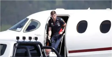  ?? (AFP) ?? Red Bull driver Max Verstappen leaves the aircraft upon his arrival to the military airport Hinterstoi­sser in Zeltweg ahead of the Austrian Grand Prix in Spielberg, Austria, yesterday.