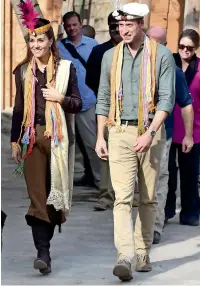  ?? Reuters ?? WEARING KALASH COLOURS: Britain’s Prince William and Catherine, Duchess of Cambridge, visit a settlement of the Kalash people in Chitral on Wednesday. —