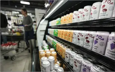  ?? MIKE STEWART — THE ASSOCIATED PRESS ?? Cans of Olipop, a drink containing botanicals, plant fibers and prebiotics, are displayed at a Kroger supermarke­t in Marietta, Ga. The frenzy of functional beverages – drinks designed to do more than just taste good or hydrate - has grown.