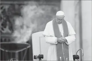  ?? ALESSANDRA TARANTINO / AP ?? Pope Francis prays Tuesday during an audience in St. Peter’s Square at the Vatican. The Vatican said Thursday that Francis has changed church teaching about the death penalty, saying it can never be sanctioned because it “attacks” the inherent dignity...