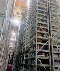  ??  ?? The shelves, produced by an Oklahoma City firm, are in the University of Arkansas’ new library storage facility and are capable of storing 1.8 million books.