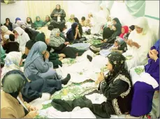  ??  ?? TRADITION: Women wrap rampies at the Palm Tree Mosque in Long Street, as part of celebratin­g the birth of the Prophet Muhammad.