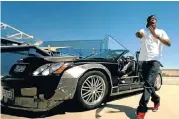  ?? Picture: YOUTUBE ?? MONEY TO BURN: Jay-Z destroys a Maybach in the music video ‘Otis’, which also features Kanye West