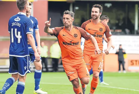  ??  ?? Scott McDonald — pictured celebratin­g scoring earlier this season — and James Keatings (right) are close to gelling up front for Dundee United.