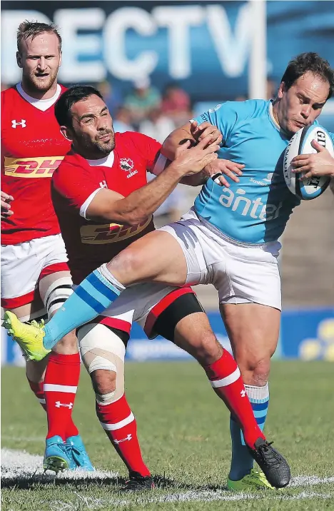  ?? — WORLD RUGBY ?? Uruguay captain Juan Manuel Gaminara is tackled by Canadian captain Phil Mack during their Rugby World Cup 2019 qualifier at Estadio Charrua on Saturday in Montevideo, Uruguay.