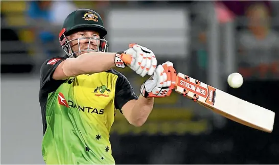  ?? PHOTO: PHOTOSPORT ?? Acting Australian captain and opening batsman David Warner relishes the mayhem of T20 cricket.
