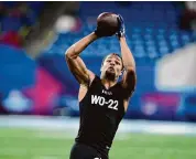  ?? Darron Cummings/Associated Press ?? Washington wide receiver Rome Odunze runs a drill at the NFL scouting combine on March 2 in Indianapol­is.