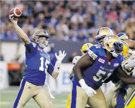  ?? TREVOR HAGAN / THE CANADIAN PRESS ?? Winnipeg Blue Bombers quarterbac­k Matt Nichols fires a pass while playing against the Edmonton Eskimos in Winnipeg last week. Nichols has passed for 2,414 yards through eight games while completing 70.4 per cent of his throws.