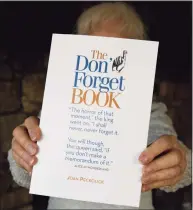  ??  ?? Joan Peckolick, of Redding, holds her a new book, “The Don’t Forget Book.”