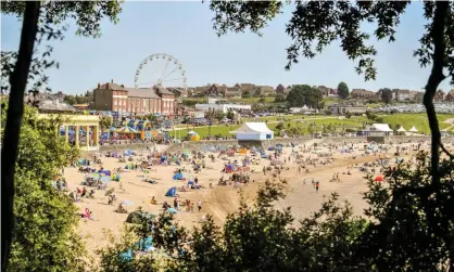  ?? Photograph: Ben Birchall/PA ?? People on Barry Island beach on Friday. First minister Mark Drakeford said the coronaviru­s crisis would not be over by Christmas.