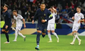  ?? Photograph: Mike Hewitt/Getty Images ?? Kylian Mbappé after tucking away a penalty to put France 3-1 ahead.